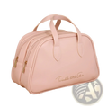 A soft pink waterproof leather travel makeup bag with structured design gold-toned zippers and handles