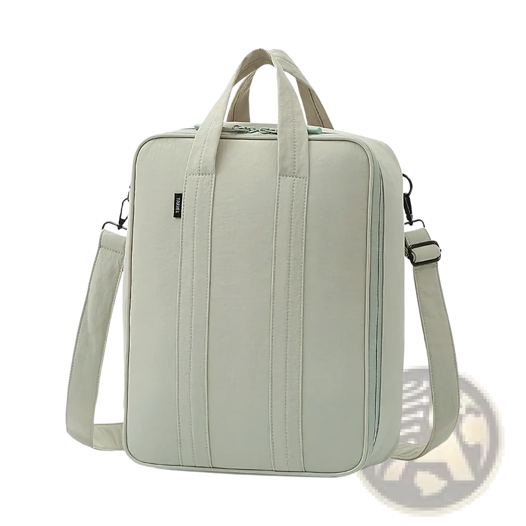 Light green canvas tote bag with dual top handles and adjustable shoulder strap for travel packing cube organizer
