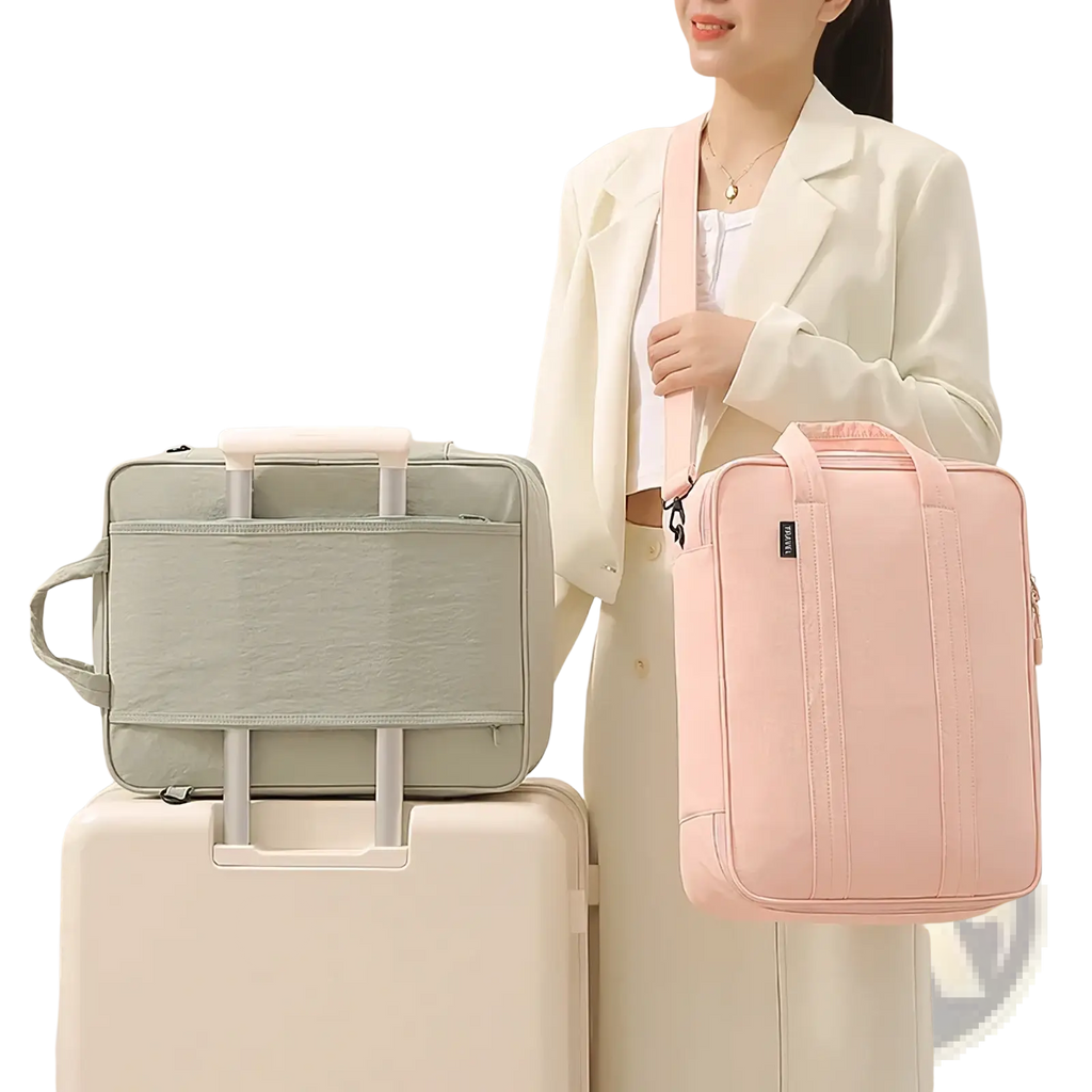 Pink fabric shoulder bag with vertical stitching and black brand tag designed as a travel packing cube luggage organizer
