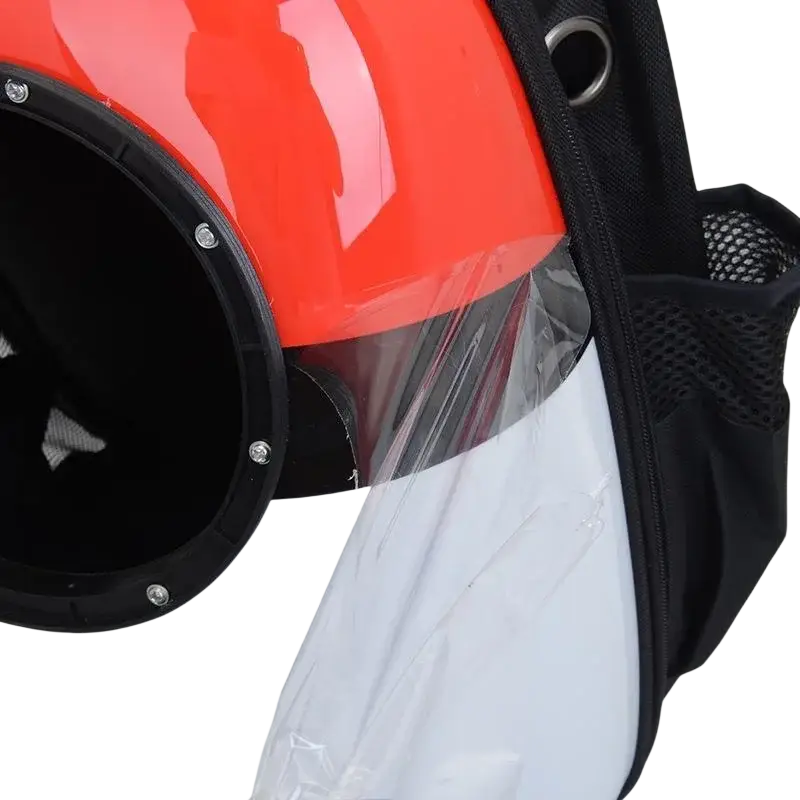 A glossy orange and white motorcycle helmet with black trim and clear visor for travel puppy cat outdoor safety