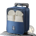 Blue fabric travel shoe bag portable mesh organizer with mesh front panel and black travel label on lower section