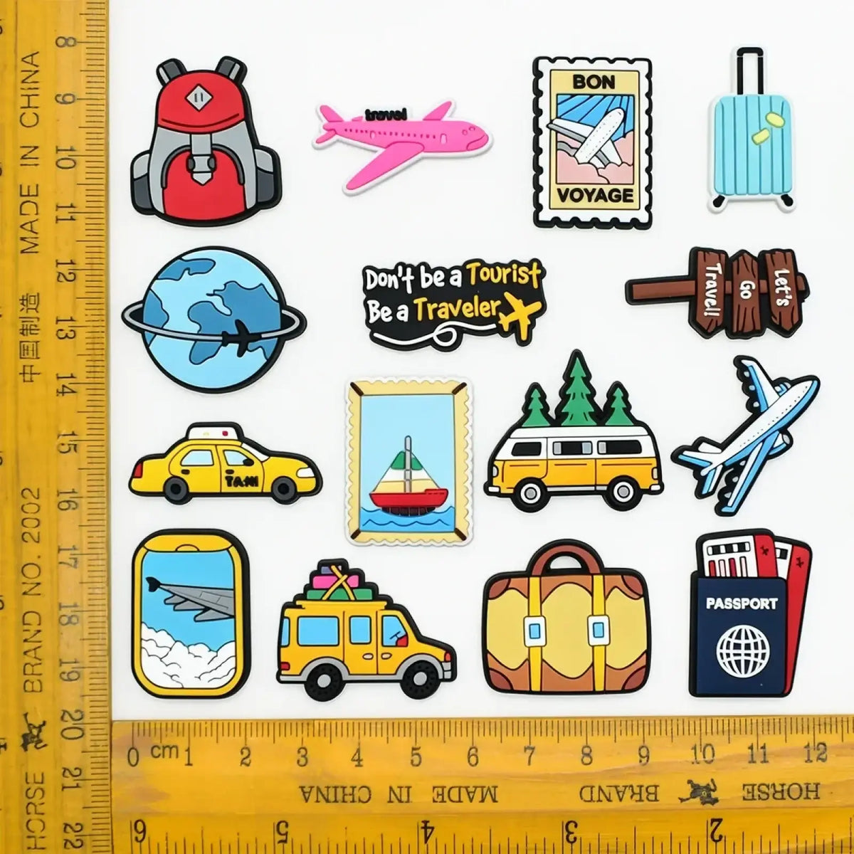 Set of colorful travel-themed pvc rubber travel shoe charms featuring backpacks airplanes and passport designs