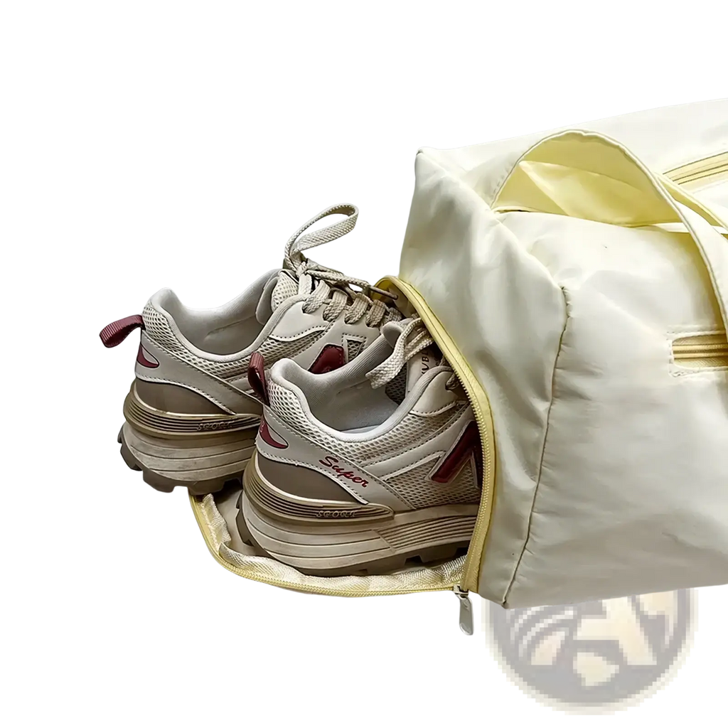 Beige and maroon new balance mesh sneakers with chunky soles nestled in a cream travel tote bag lightweight nylon shoulder handbag