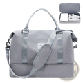 Gray textured fabric travel tote bag with matching shoulder strap and top handles featuring shoe compartment