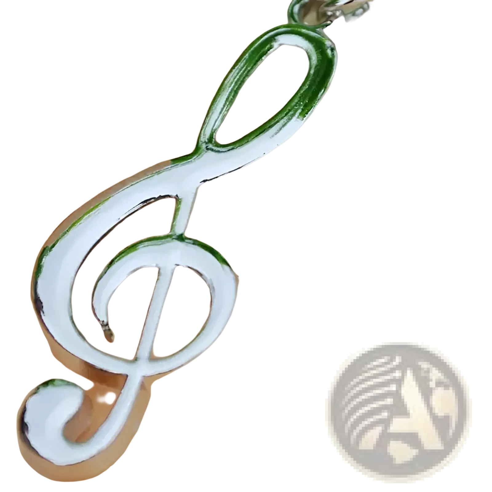 Silver and green metallic treble clef music note keychain with polished reflective finish in silver metal