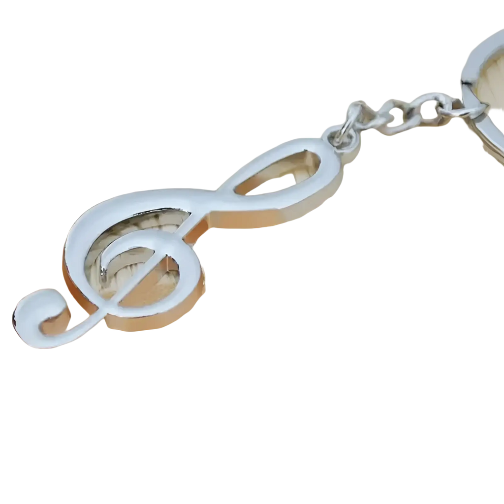 Silver metal treble clef music note keychain with polished reflective finish and attached chain