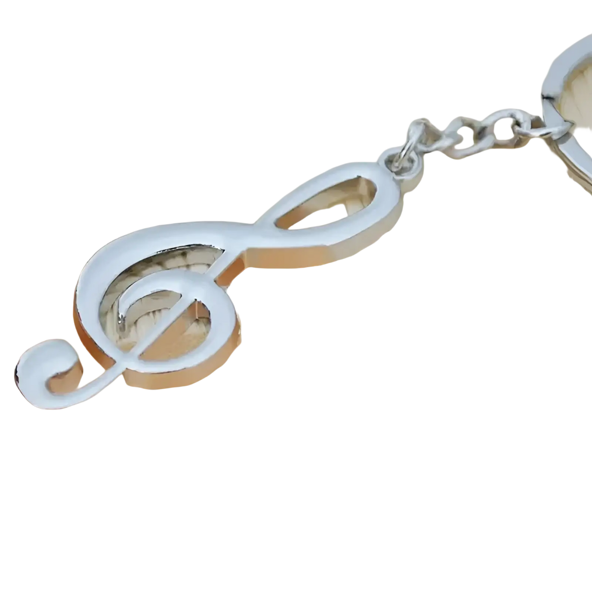Silver metal treble clef music note keychain with polished reflective finish and attached chain