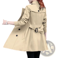 Beige midi length double breasted trench coat for women with black buttons and matching belt with rectangular buckle