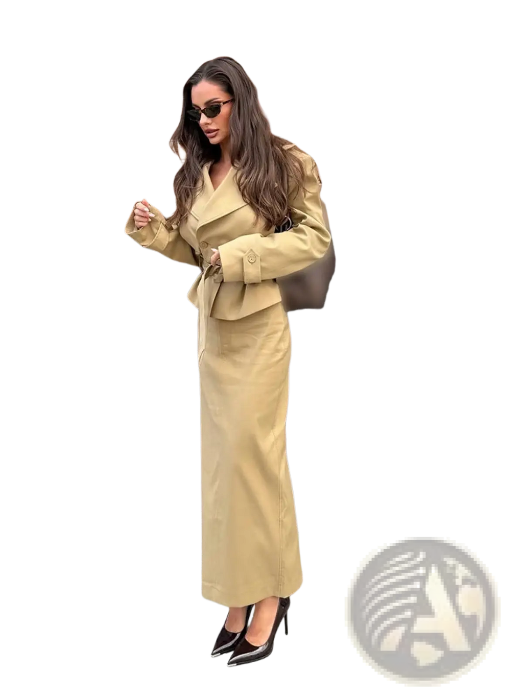 A tan trench co ord skirt set featuring a belted waist trench coat and matching high waisted trousers