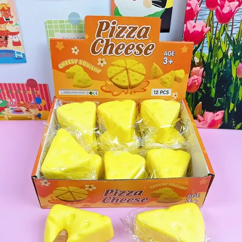 Bright yellow cheese-shaped slow rising squishy toy set in a box labeled pizza cheese 12-piece triangle cheese set