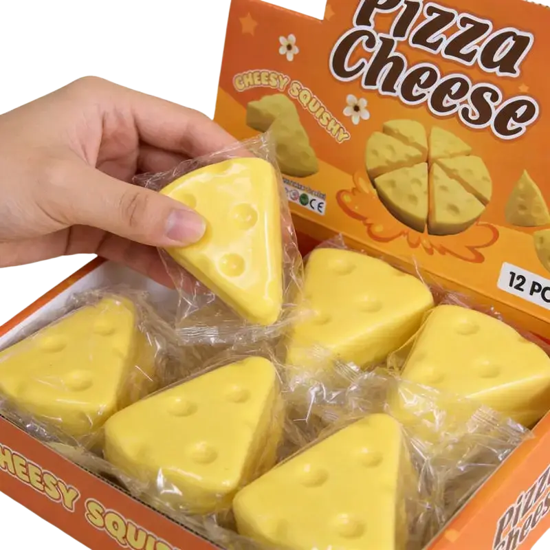 Yellow triangular cheese-shaped slow rising squishy toy in clear plastic packaging from 12-piece set