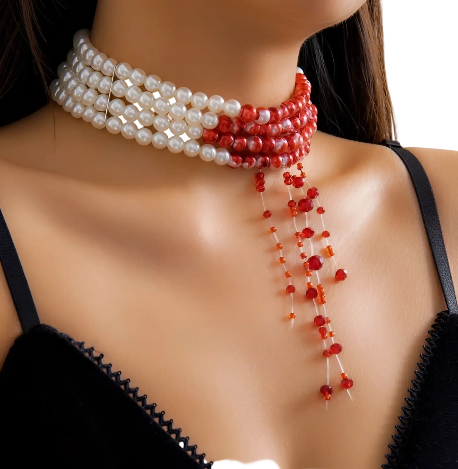 A triple layer choker necklace featuring two white and one red pearl rows with cascading red beads below