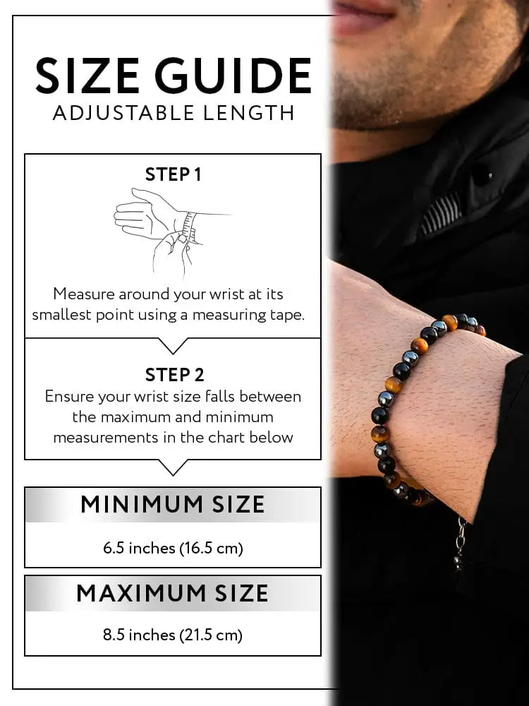 A triple protection tiger eye and obsidian chain bracelet with alternating tiger eye and black magnetic stones worn on a man’s wrist