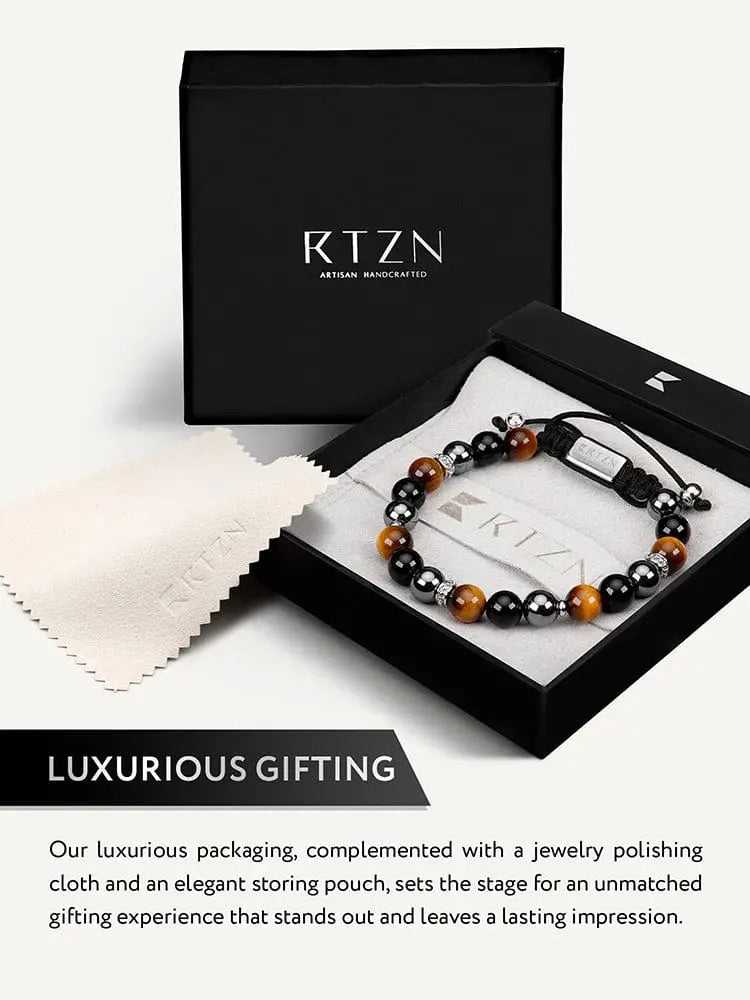 Black and tiger eye bead bracelet with silver-toned accents in a sleek black rtzn artisan handcrafted gift box