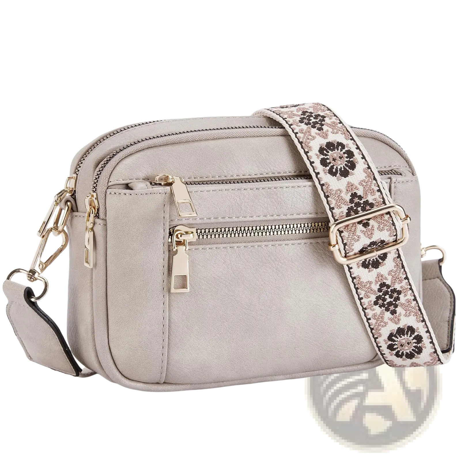 Gray faux leather crossbody bag with triple gold-tone zippers and a floral-patterned strap for everyday use
