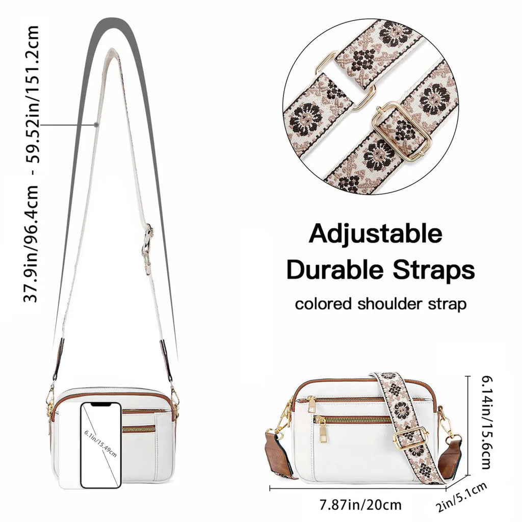 White crossbody bag with triple zipper, adjustable floral strap, colorblock design, and gold-tone hardware