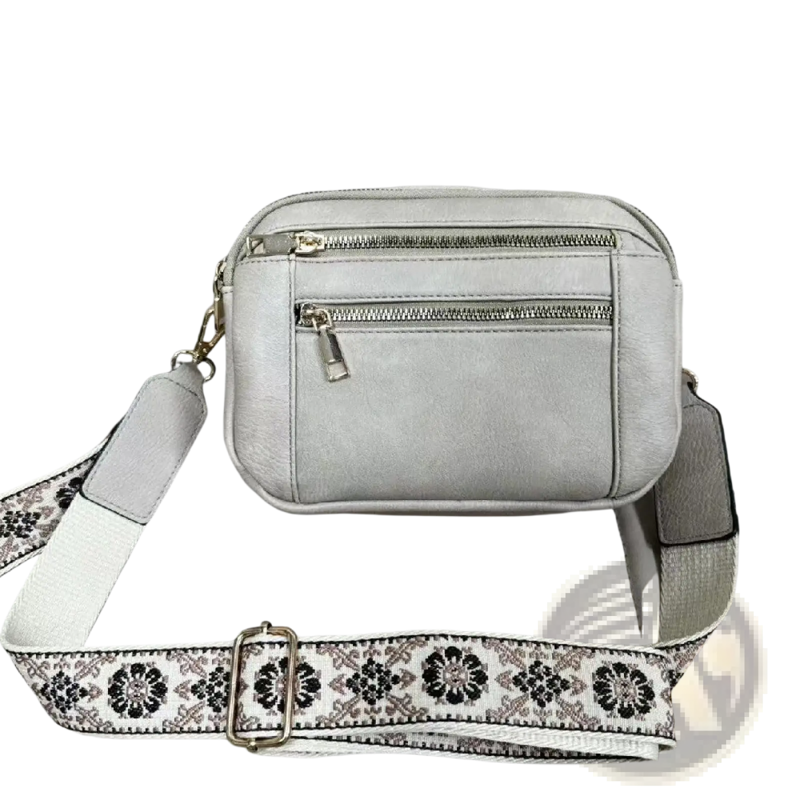 Light gray faux leather crossbody bag with triple zippers and a decorative floral colorblock strap