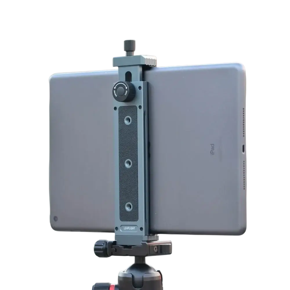 Gray metallic aluminum tripod mount adapter tablet clamp securely holds a silver iPad on a tripod with universal fit