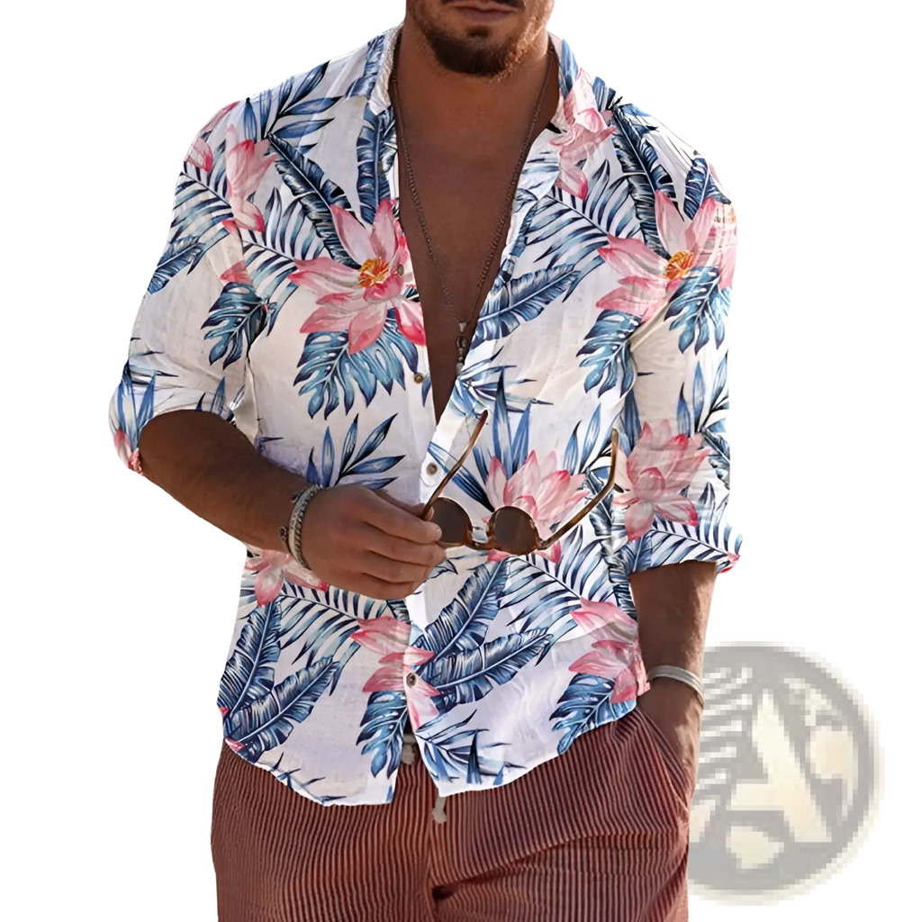 A man wearing a white long sleeve mens beach shirt with vibrant pink and blue tropical floral patterns
