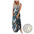 A sleeveless flowing maxi dress with a vibrant tropical leaf print in deep green teal and white featuring an irregular hem