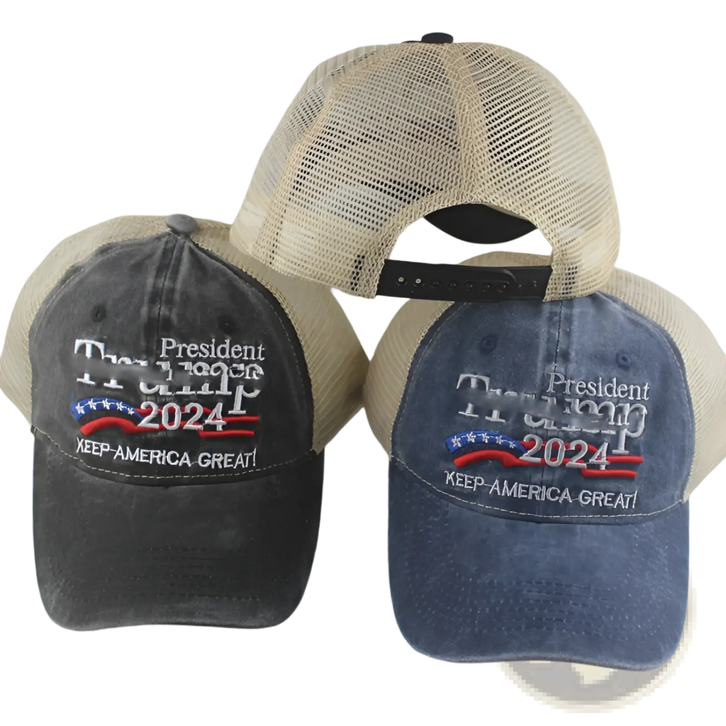 Two trucker hats in faded black and blue denim with beige mesh back panels featuring trump 2024 embroidery