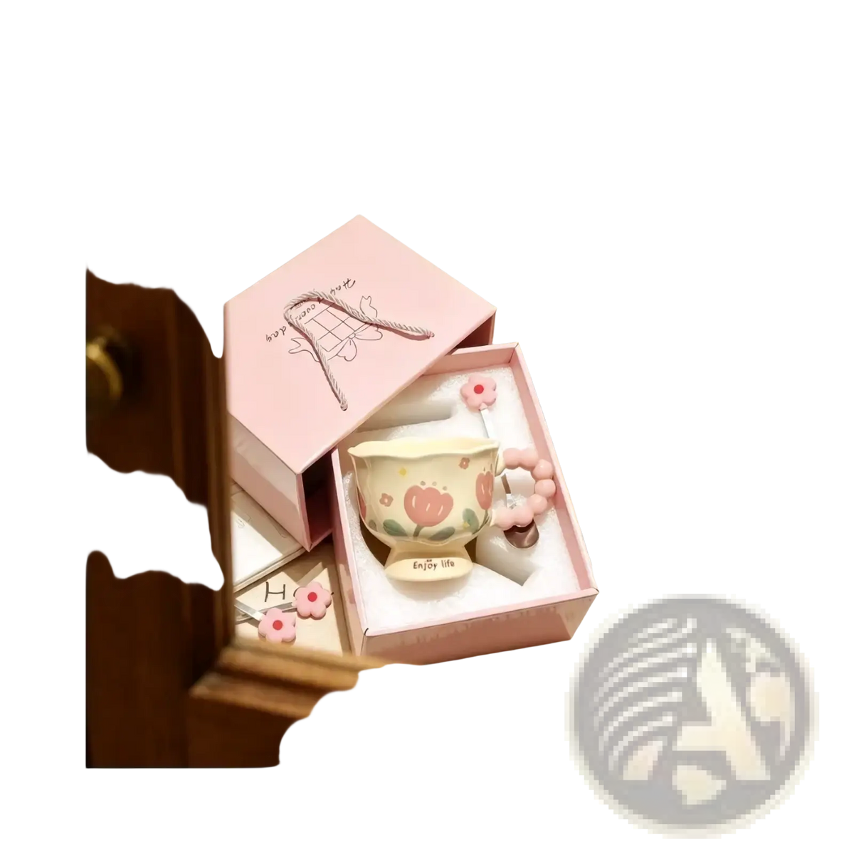 A pastel pink tulip ceramic mug with floral design and flower-shaped handle in a matching pink gift box