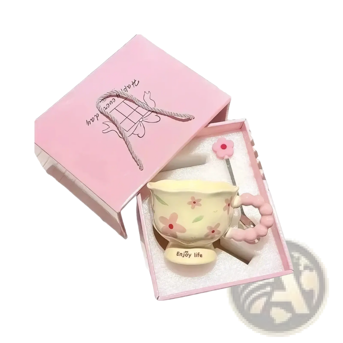 Pastel yellow tulip ceramic mug with pink floral decals and beaded handle in a pink floral gift box