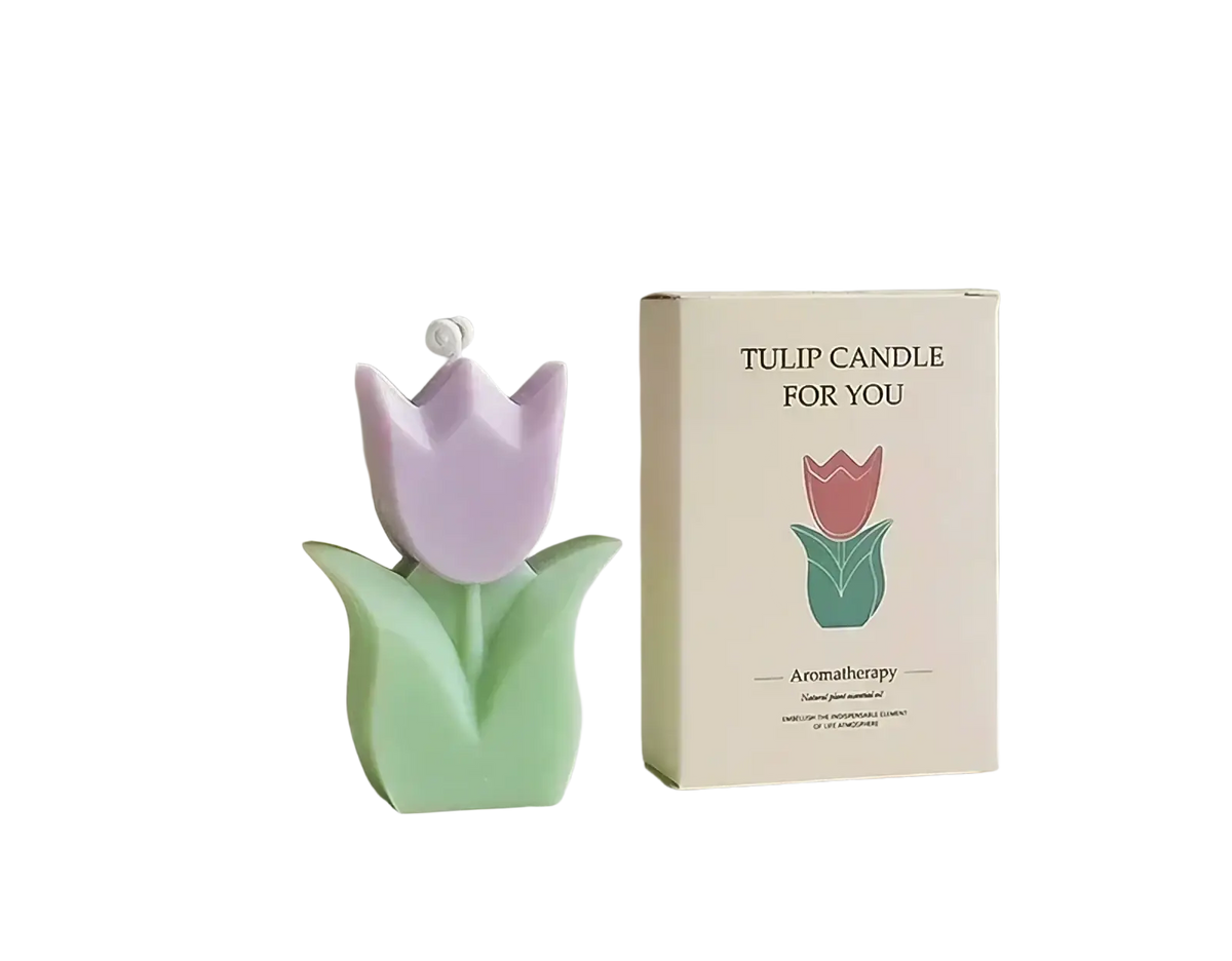 A pastel purple and mint green tulip-shaped scented candle with a white wick in a tulip candle for you box