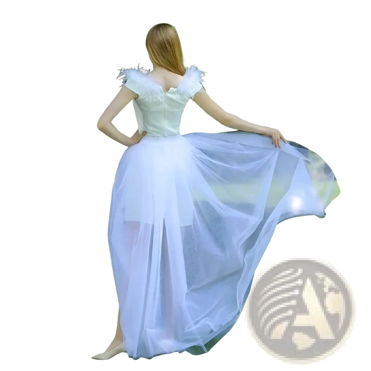 A flowing white tulle maxi skirt with a feathered bodice detachable wedding overskirt shown from the back