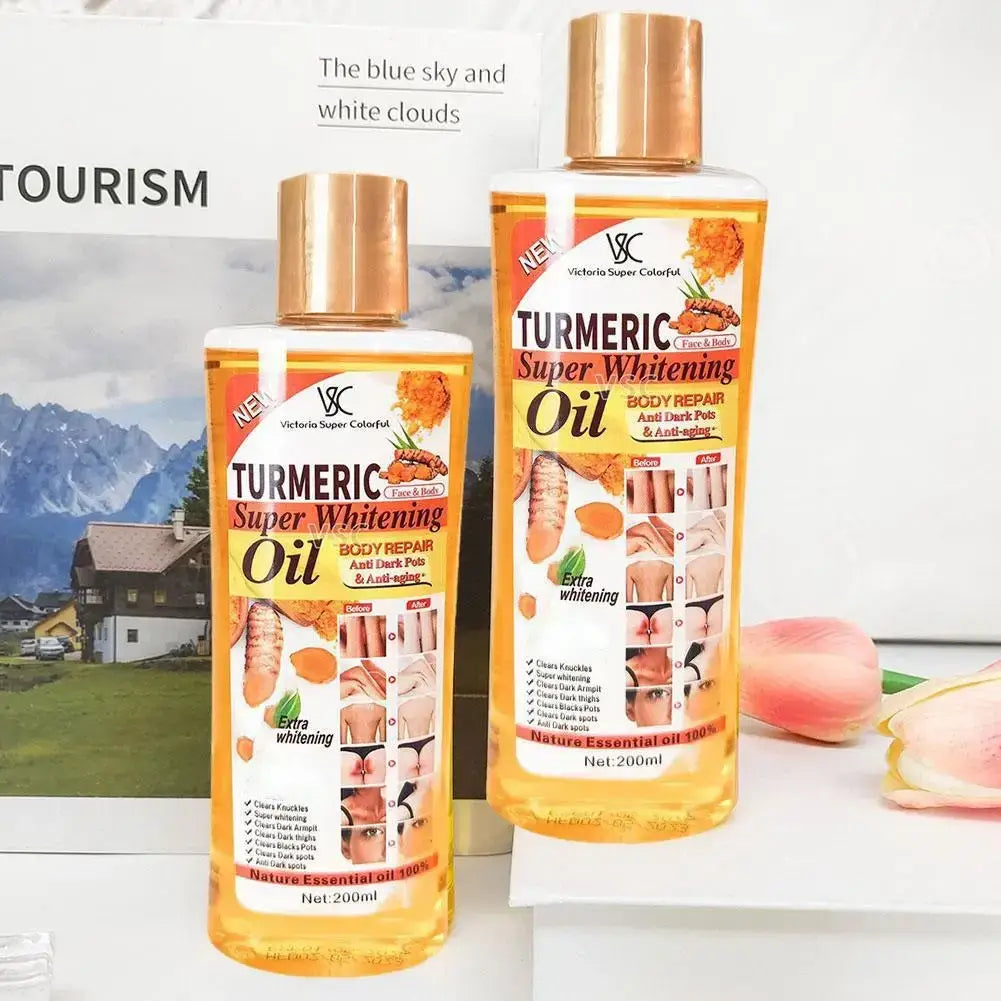 Two transparent bottles of victoria super colorful turmeric essential oil with gold caps for moisturizing body and face care 200ml