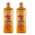 Two laiou yan beauty turmeric essential oil bottles with gold caps and amber glass for moisturizing body and face care 200ml