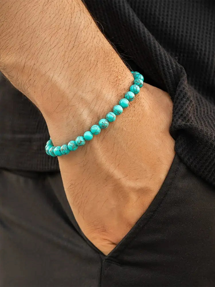 Handcrafted Bali turquoise stone beaded bracelet with silver clasp featuring smooth rounded beads worn on a wrist