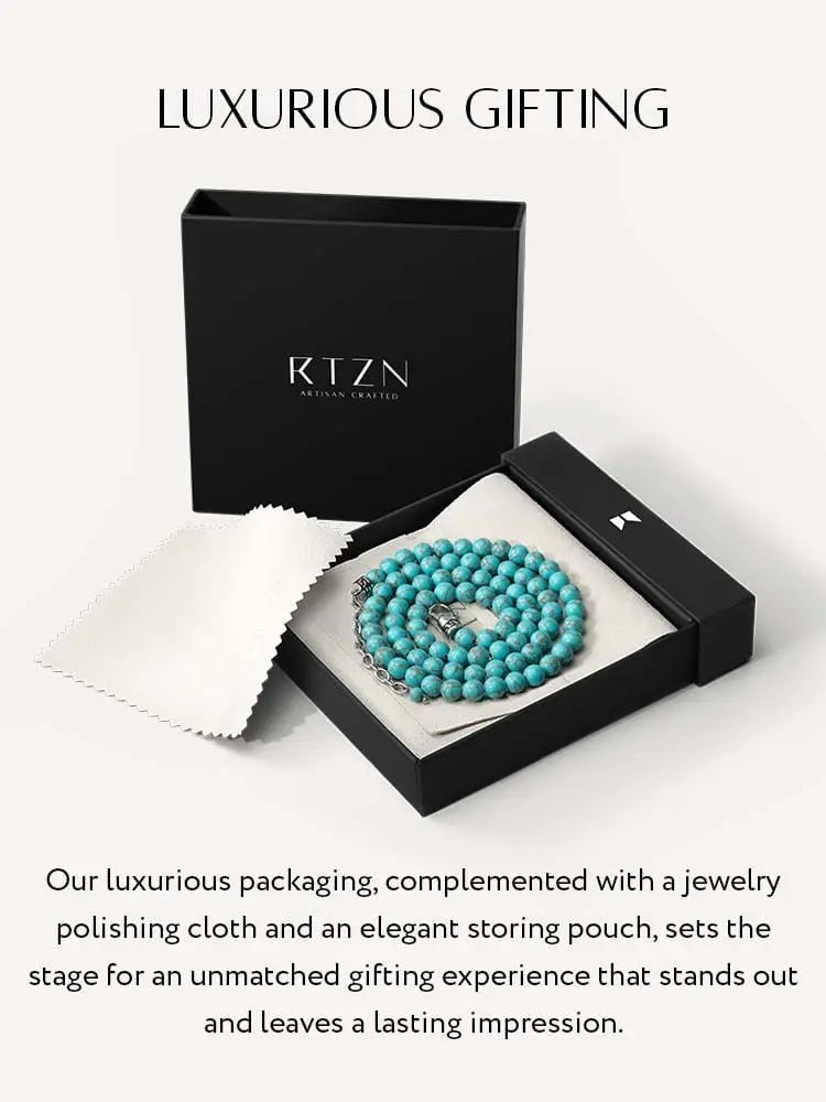 Adjustable turquoise bead necklace in stainless steel with silver clasp displayed in an elegant black gift box
