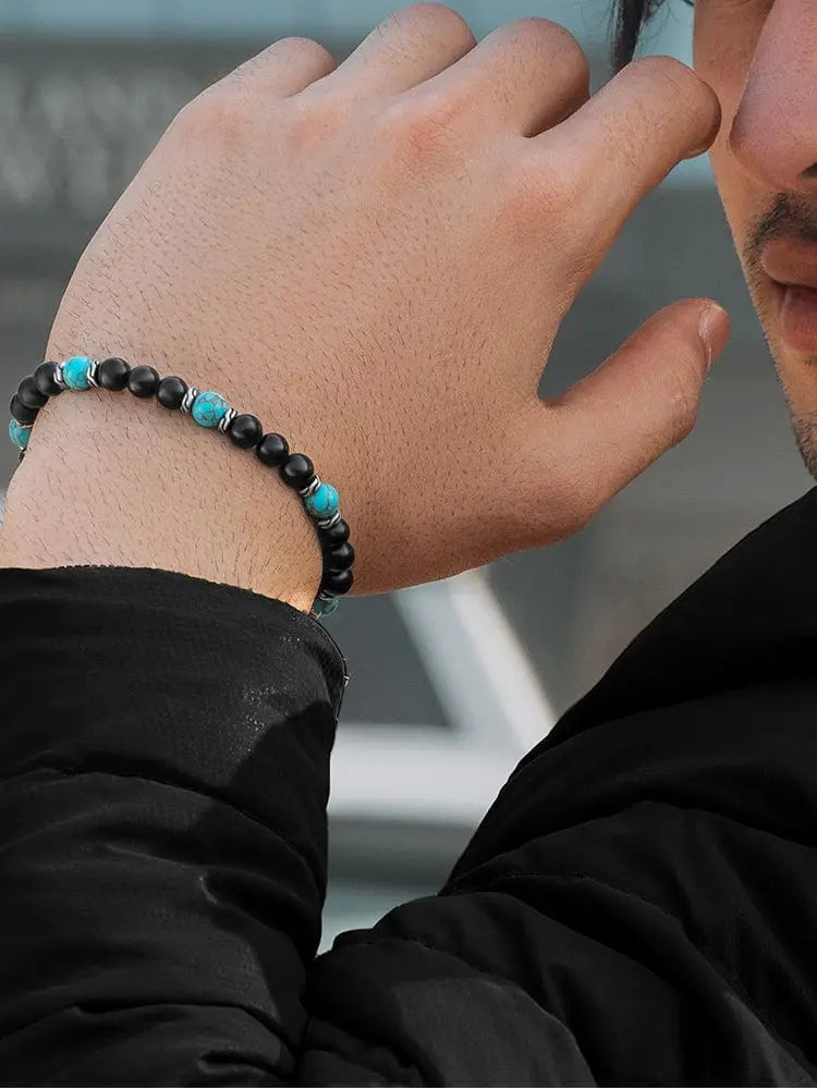 Navajo turquoise and black onyx adjustable beaded bracelet featuring black and turquoise beads with silver-toned spacers