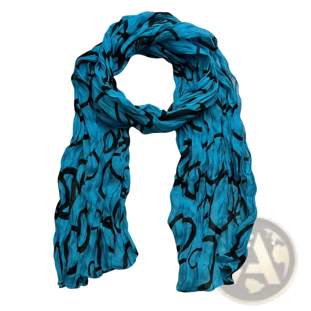 A turquoise crinkle beach cover up scarf with lightweight fabric and bold black abstract patterns