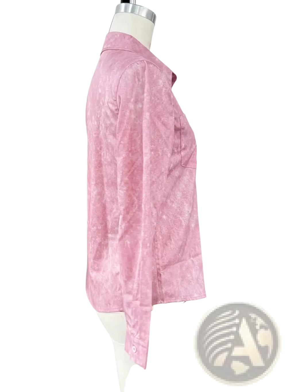 A soft pink long-sleeved button-up shirt with a subtle texture displayed as a turquoise distressed denim lapel shirt