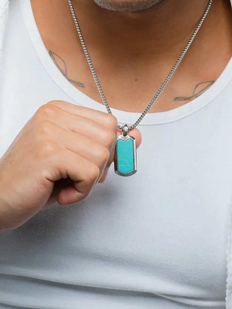 Aaa turquoise inlay stainless steel dog tag necklace with a turquoise pendant and silver toned metal frame and chain