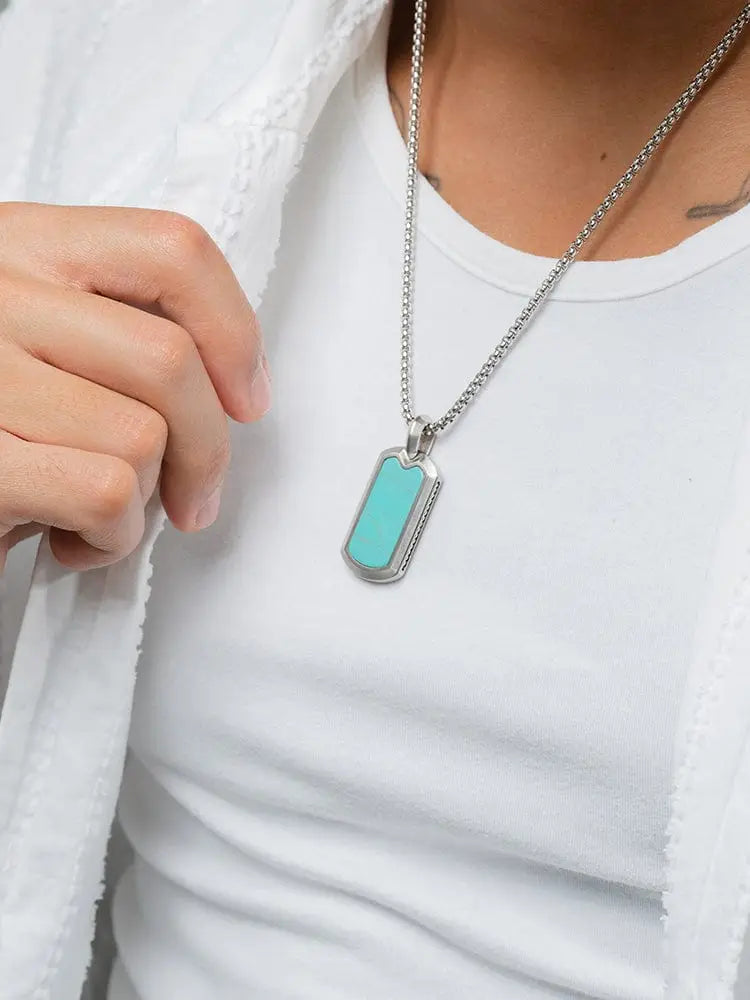 A sleek silver stainless steel dog tag necklace with a vibrant turquoise inlay named Aaa Turquoise Inlay
