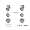 Silver-toned dangle earrings with turquoise stone, sunburst oval, and engraved heart pendant in turquoise heart and sunburst set