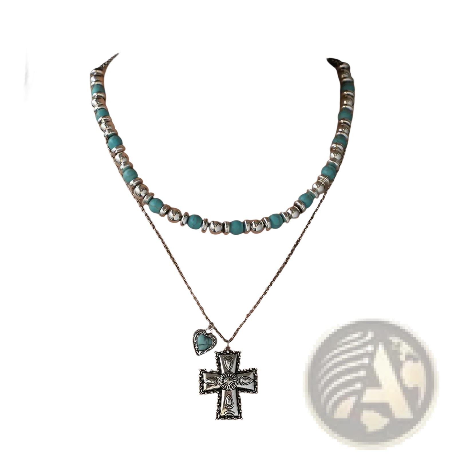 A layered turquoise bead and silver necklace with a detailed cross pendant from the turquoise heart and sunburst set