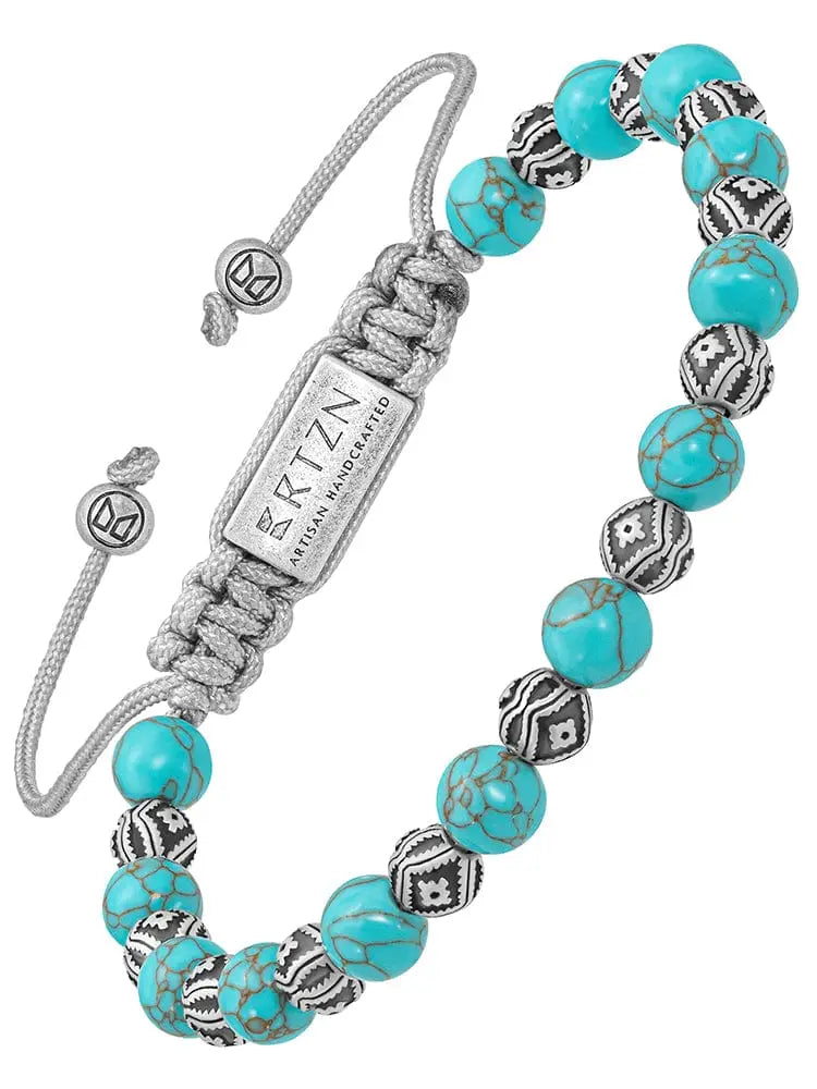Native turquoise and silver beaded bracelet with turquoise and black patterned beads and silver-toned toggle clasp
