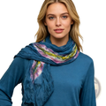 A soft turquoise tie dye cotton crinkle scarf with a vibrant pink yellow and green pattern draped around a model’s neck