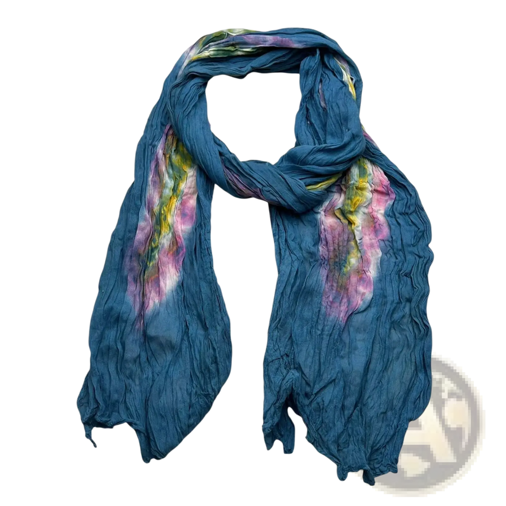 A crinkled turquoise cotton scarf featuring vibrant pink and yellow tie dye patterns