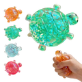 A translucent green turtle toy fidget toy stress ball filled with sparkling star confetti for soft squeeze relief