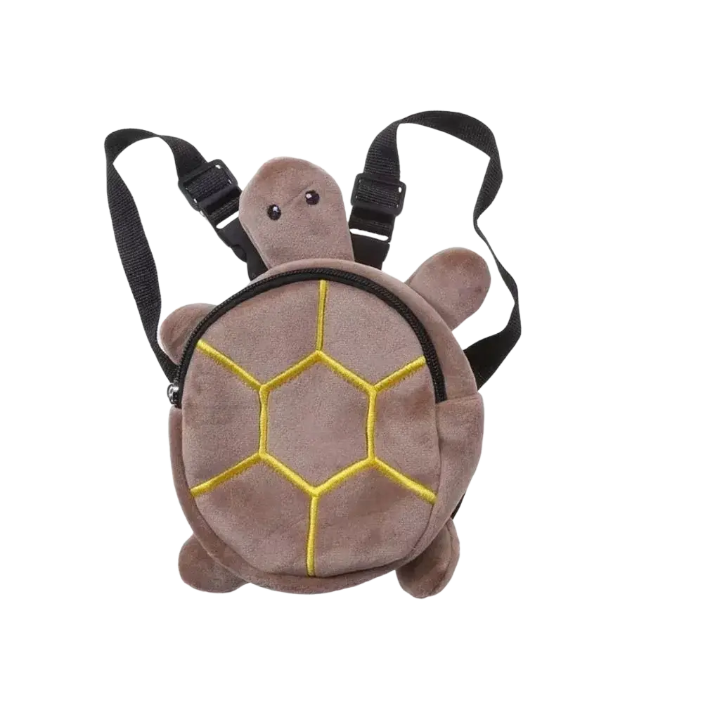 A plush brown turtle shape dog backpack with yellow embroidered shell patterns and black adjustable straps
