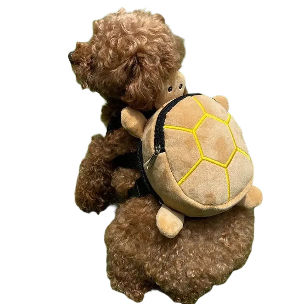 A plush tan turtle shape dog backpack with yellow stitching and black zipper designed as a pet carrier