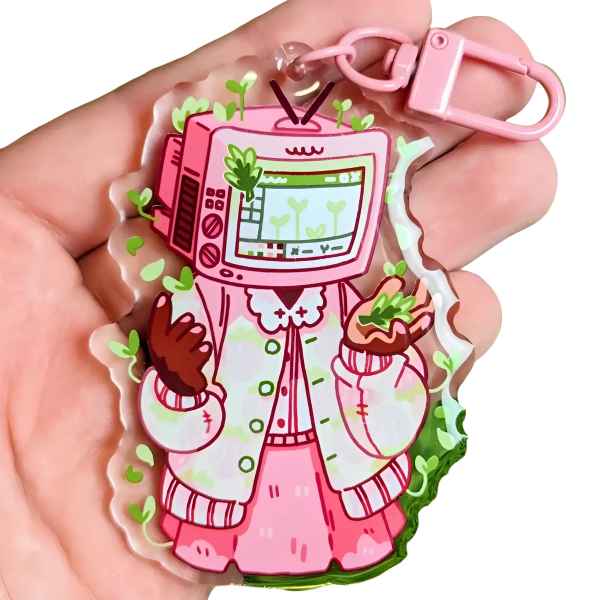 Pink acrylic tv head anime keychain featuring a cartoon character in a pink and white patterned coat bag charm