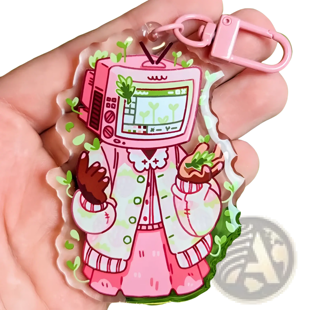 Pink acrylic tv head anime keychain featuring a cartoon character in a pink and white patterned coat bag charm