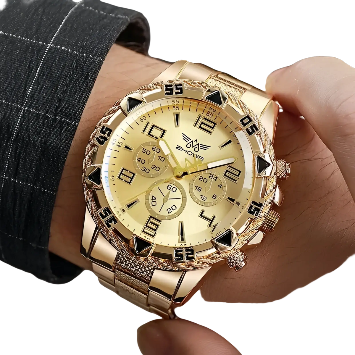 Tvk stainless steel chronograph quartz watch with gold-tone case textured bezel and cream-colored face with three subdials