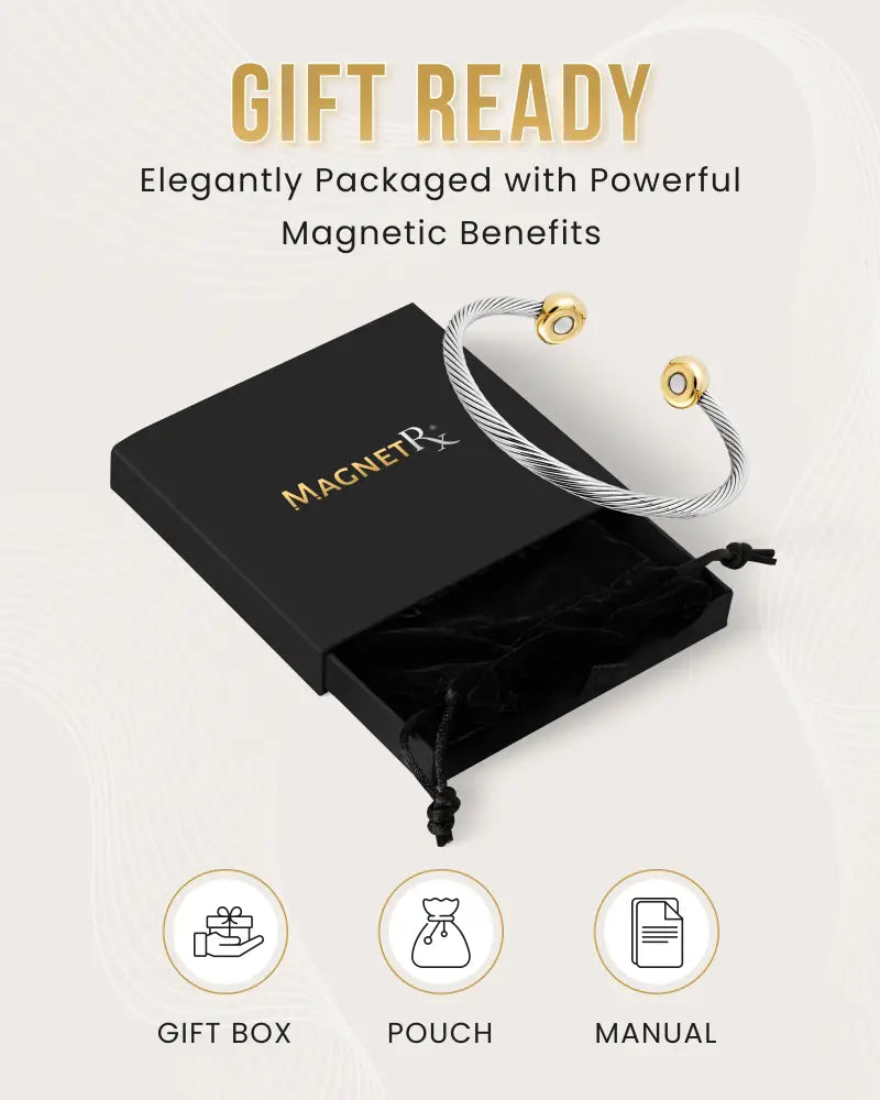 Twisted cable magnetic cuff bracelet in silver with gold-toned magnetic ends displayed in a black gift box